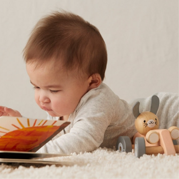 A baby reading a book.