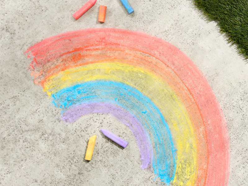 Rainbow chalk drawing on sidewalk