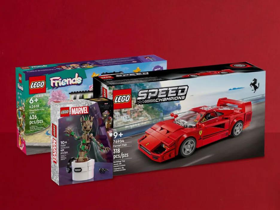 Three boxes of LEGO® sets against a red background.